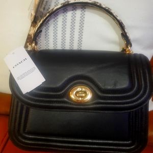 Coach black leather shoulder bag.